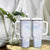 Samoa White Sunday Tumbler With Handle Sweet Pastel Plumeria Floral