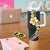 Pacific Hibiscus and Plumeria with Tapa Pattern Tumbler With Handle Black Color