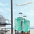 Puakenikeni and Maile Lei Luggage Cover Sage Green Double Strand Lei